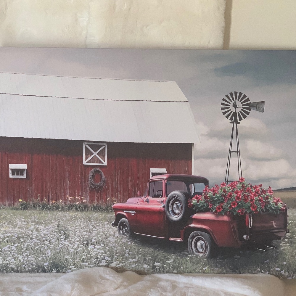 Red truck with barn and flowers